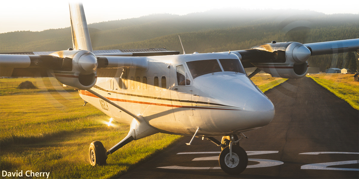 Jump airplane appearing to turn off of, or around in, the runway
